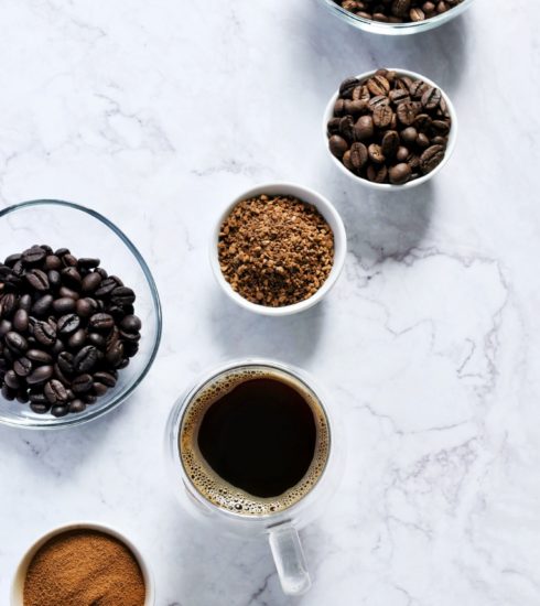 Coffee mug and coffee beans on a counter
