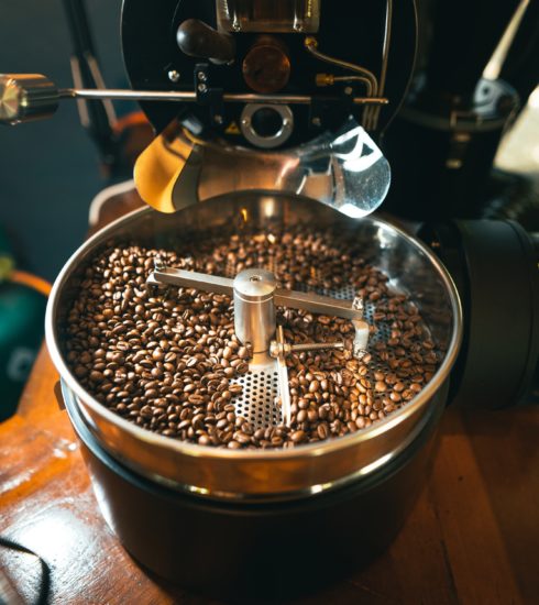 Roasted coffee beans in the machine at a coffee shop