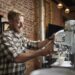 Man preparing espresso in a cafe