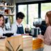 Asian barista or coffee maker receive the order from customer woman