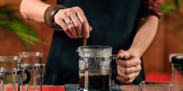 Barista Making French Press Coffee
