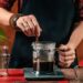 Barista Making French Press Coffee