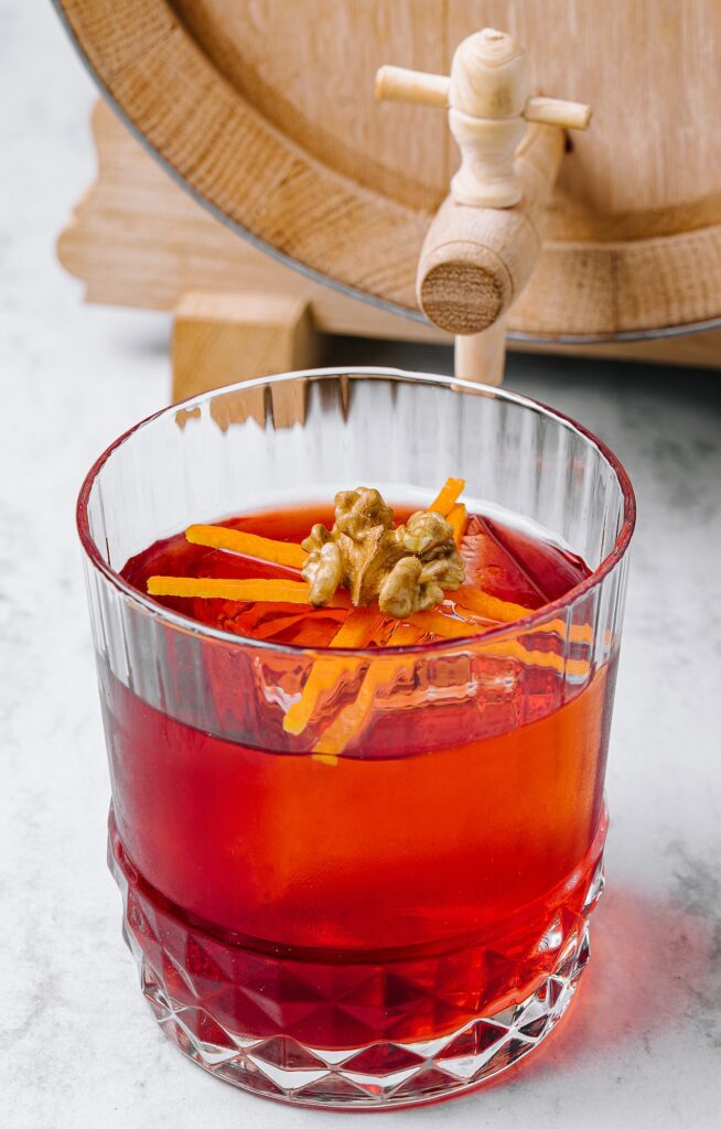 Barrel aged coffee negrony cocktail garnished with an orange peel