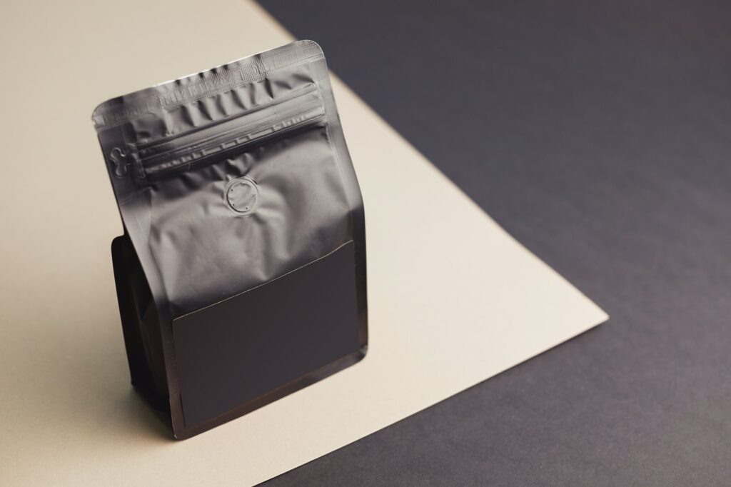 Black blank plastic vacuum sealed pouch coffee bag mockup. Packaging template mockup