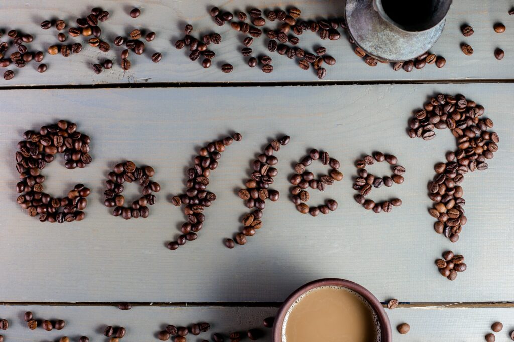 Coffee Inscription. Word Coffee on The Table near Cup. Flat Lay.