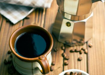 coffee with coffee beans and coffee maker