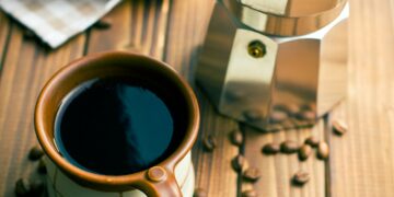 coffee with coffee beans and coffee maker