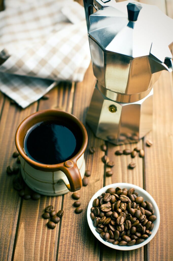 coffee with coffee beans and coffee maker