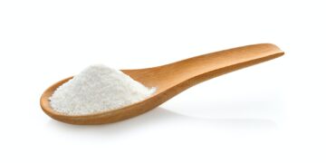 Creamer, Coffee whitener, Non-dairy creamer in wood spoon on whi