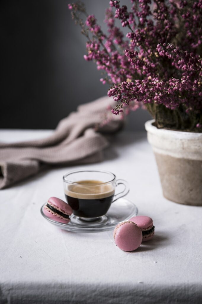 Cup of espresso with macaroons
