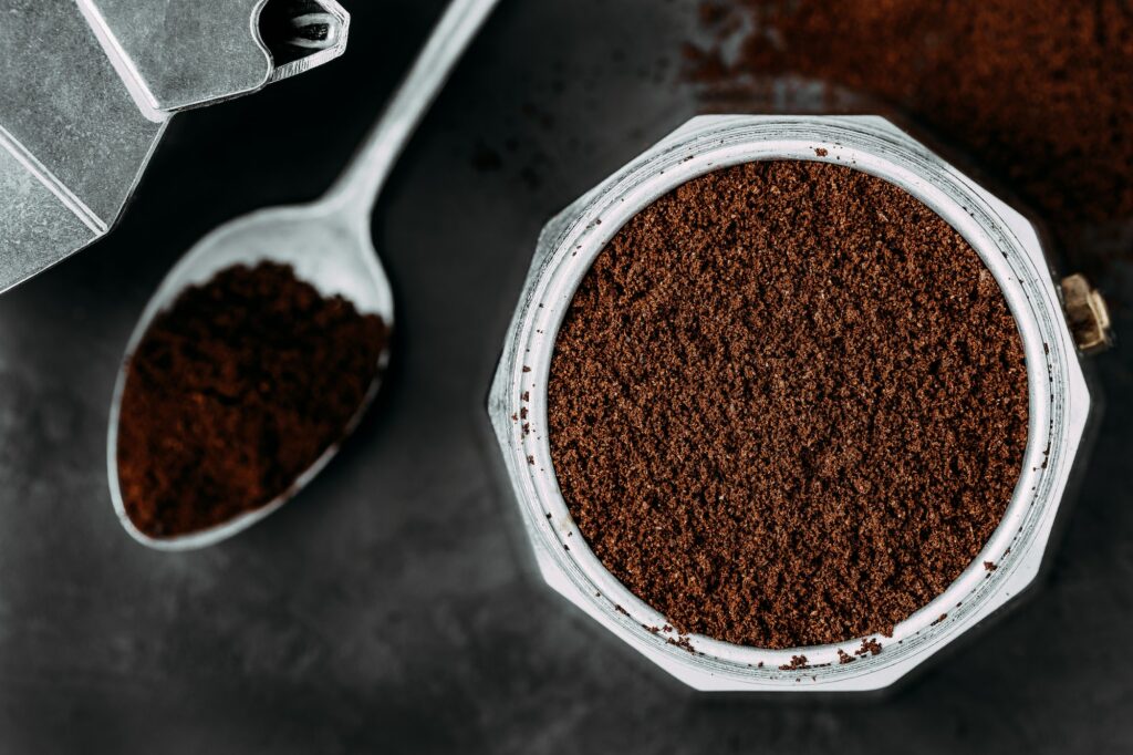 Ground coffee. Coffee moka pot make on dark background