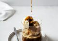 Ice cream with coffee espresso in glass on white or grey background
