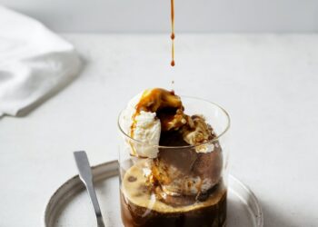 Ice cream with coffee espresso in glass on white or grey background