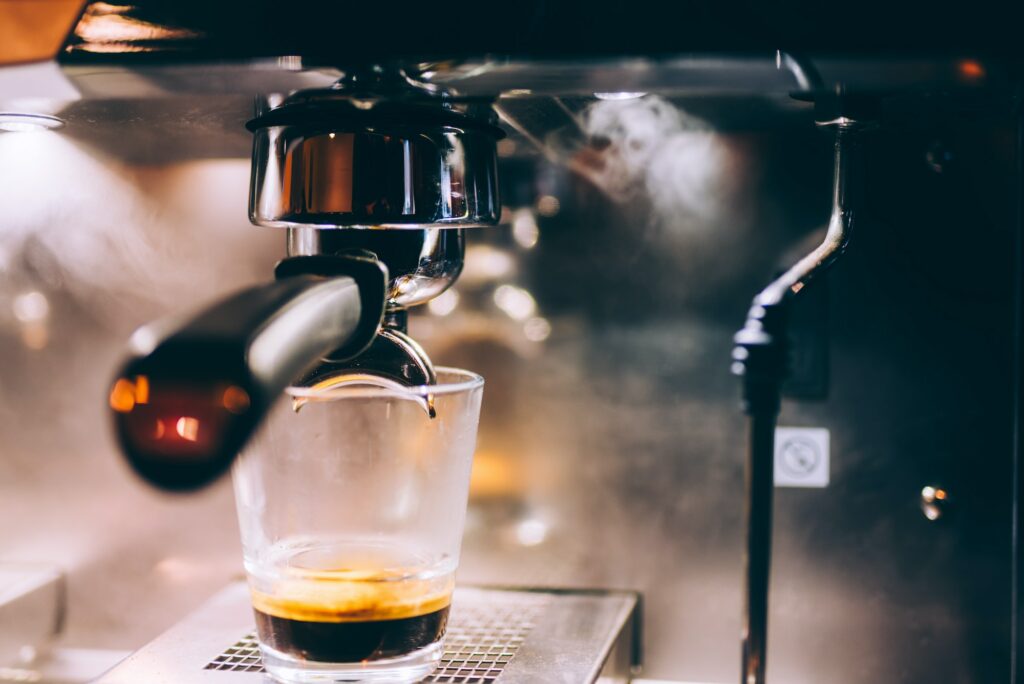 Professional espresso machine preparing fresh espresso in local pub, bistro or restaurant