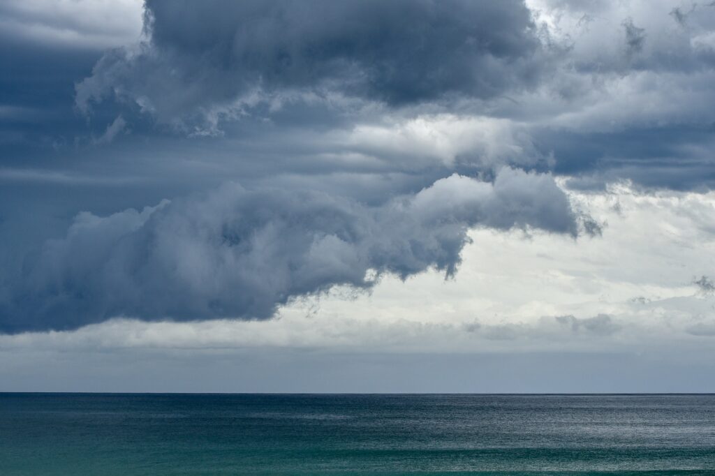 Storm clouds rolling in over the South Pacific and Pebbly Beach at the Murramarang National Park.