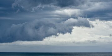 Storm clouds rolling in over the South Pacific and Pebbly Beach at the Murramarang National Park.