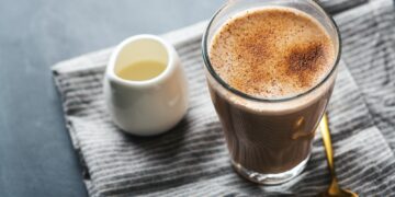 Chai latte in glass with milk