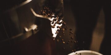 Coffee beans flowing from coffee roaster