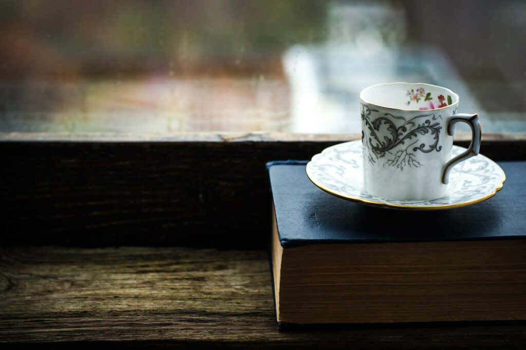 Coffee cup with old book