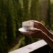 coffee on the balcony with forest view, white cup close up, background, morning rituals, relaxing