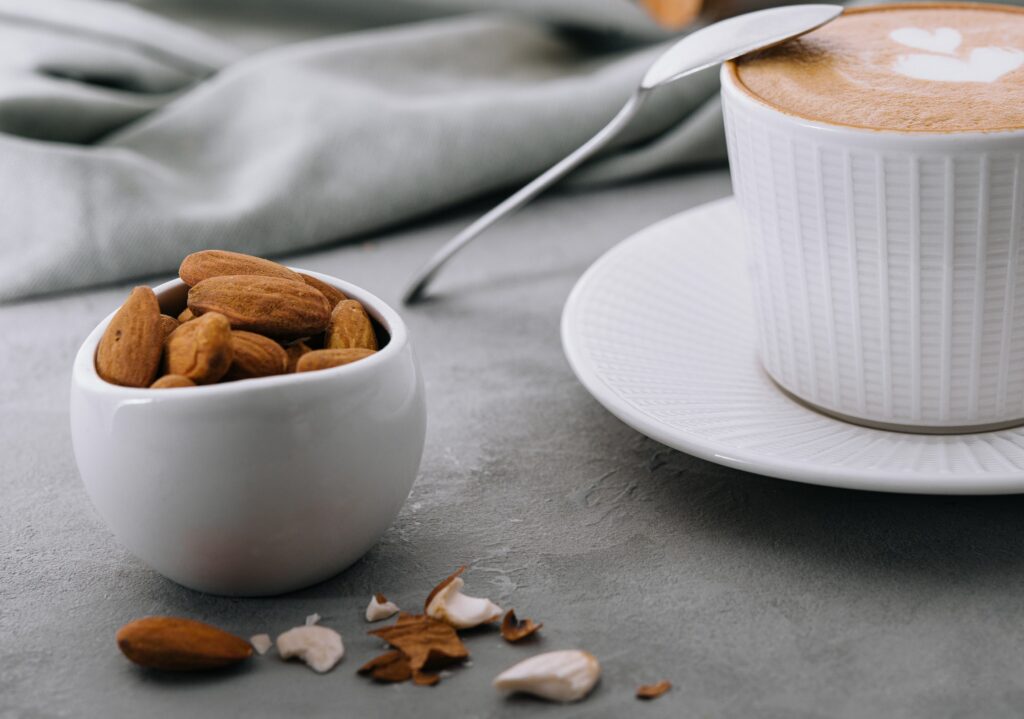 coffee with almonds on stone table