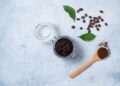 Concept with natural ingredients for home body coffee scrub with coffee beans and coffee powder