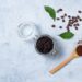 Concept with natural ingredients for home body coffee scrub with coffee beans and coffee powder