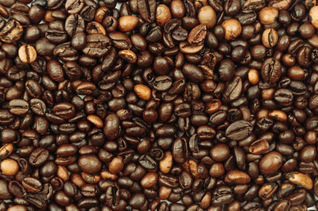 different types of roasted coffee beans texture background.