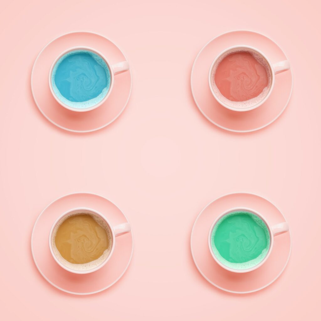 Four coffee cups of different colors. Minimal style