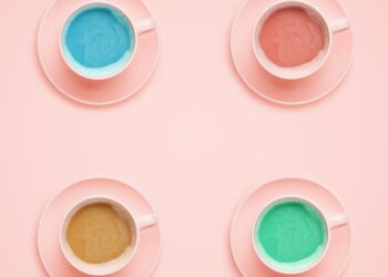 Four coffee cups of different colors. Minimal style
