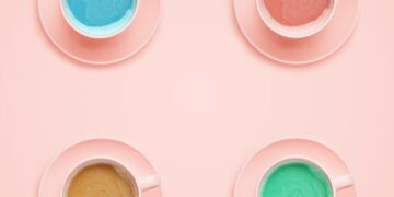 Four coffee cups of different colors. Minimal style