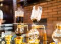 Siphon vacuum coffee maker on cafe bar