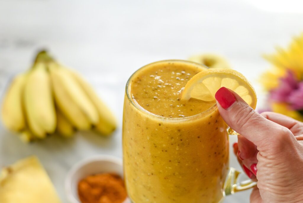 Yellow smoothie made from fresh healthy organic ingredients