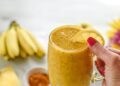 Yellow smoothie made from fresh healthy organic ingredients