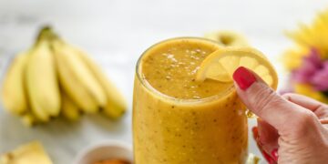 Yellow smoothie made from fresh healthy organic ingredients