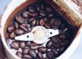 Closeup of coffee beans in a coffee grinder
