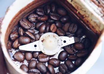 Closeup of coffee beans in a coffee grinder