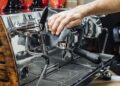 Barista cleaning the coffee maker