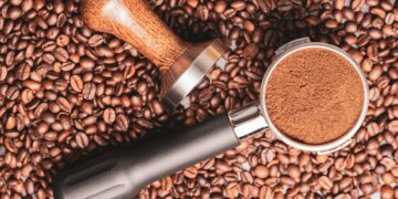 Portafilter container and tamper with whole beans on the table