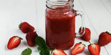 Jar with strawberry smoothie