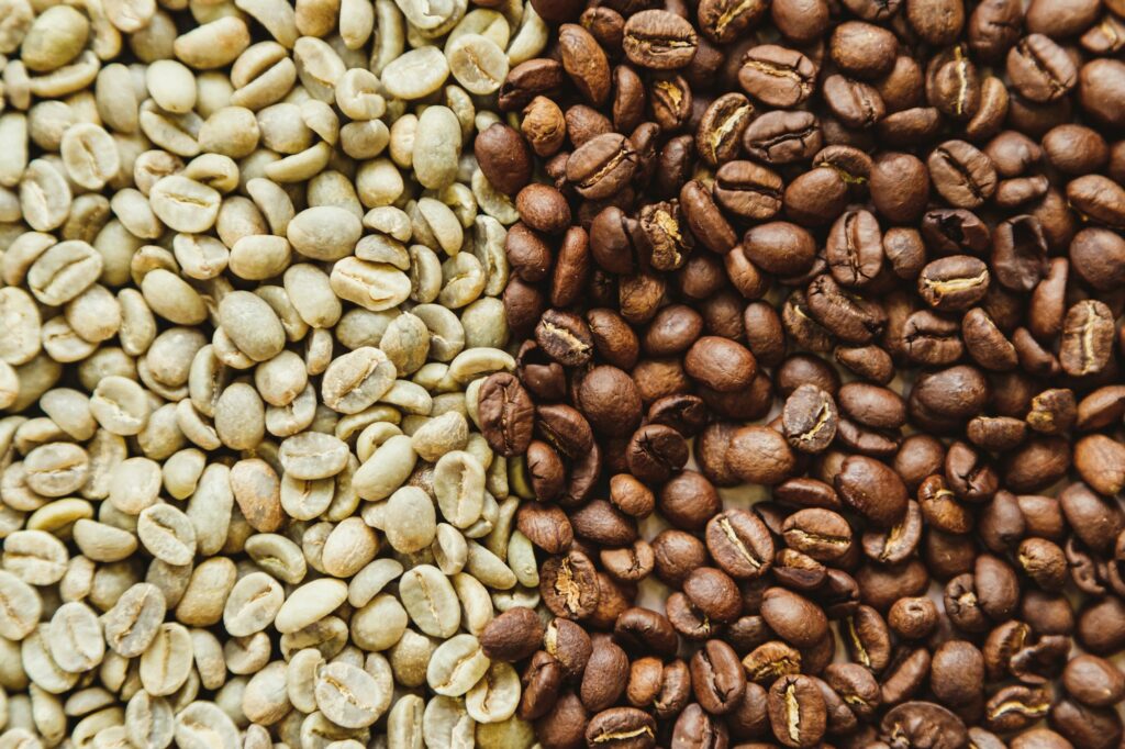 Raw green and roasted coffee beans texture background